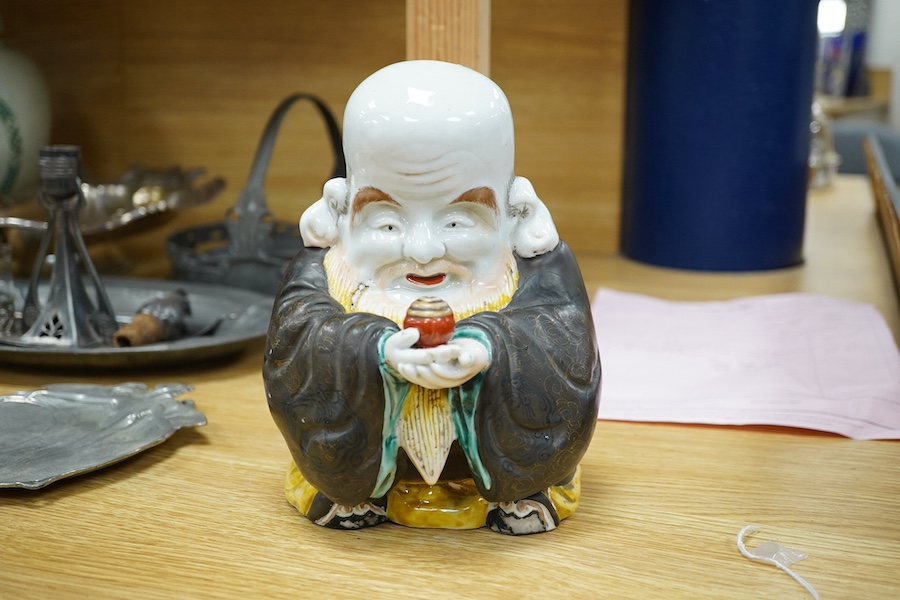 A Japanese green Kutani porcelain figure of Fukurokuju, 19cm. Condition - poor, large hairline crack across back shoulders and to base